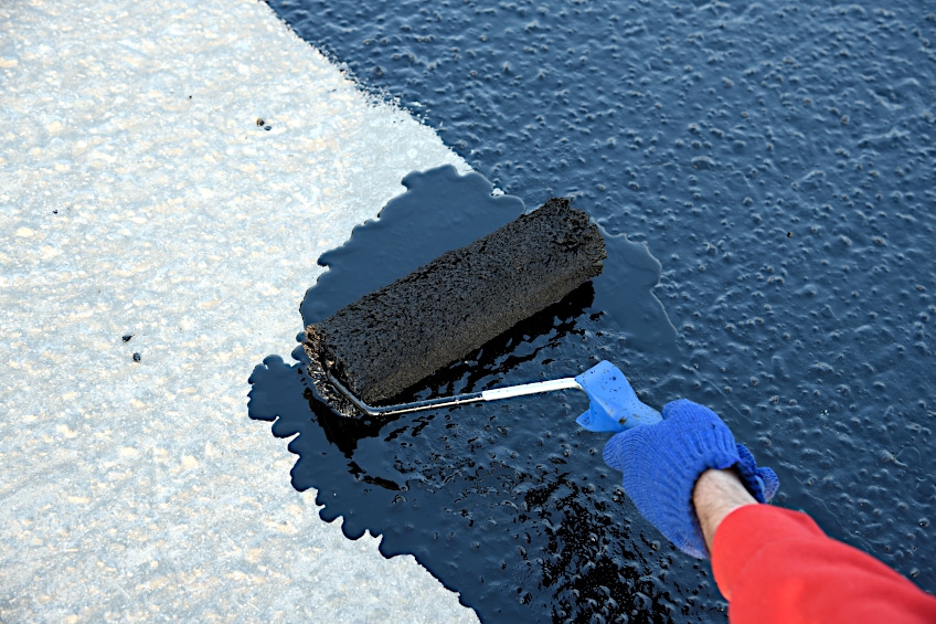 Applying Driveway Paint with Roller