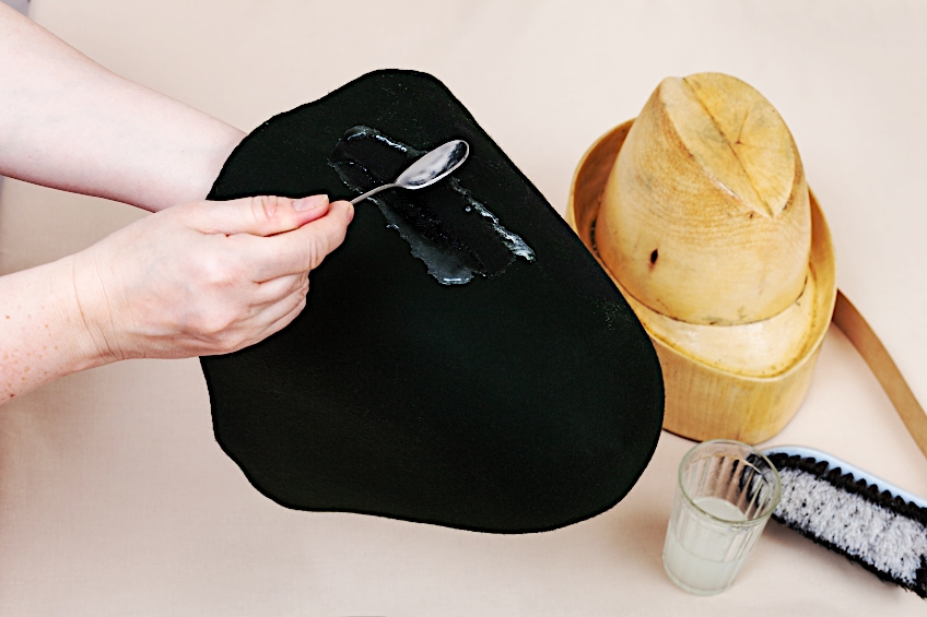 Applying Glue to Felt to Make a Hat