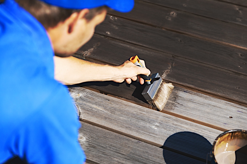 Applying Stain to Wooden Deck