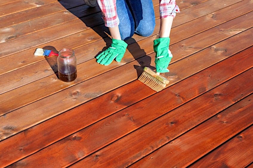 Applying Stain to Wooden Deck